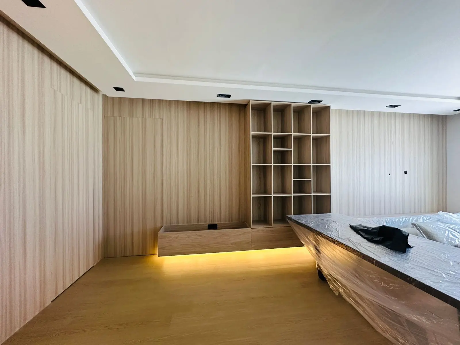 Bedroom wall cladding and custom shelves